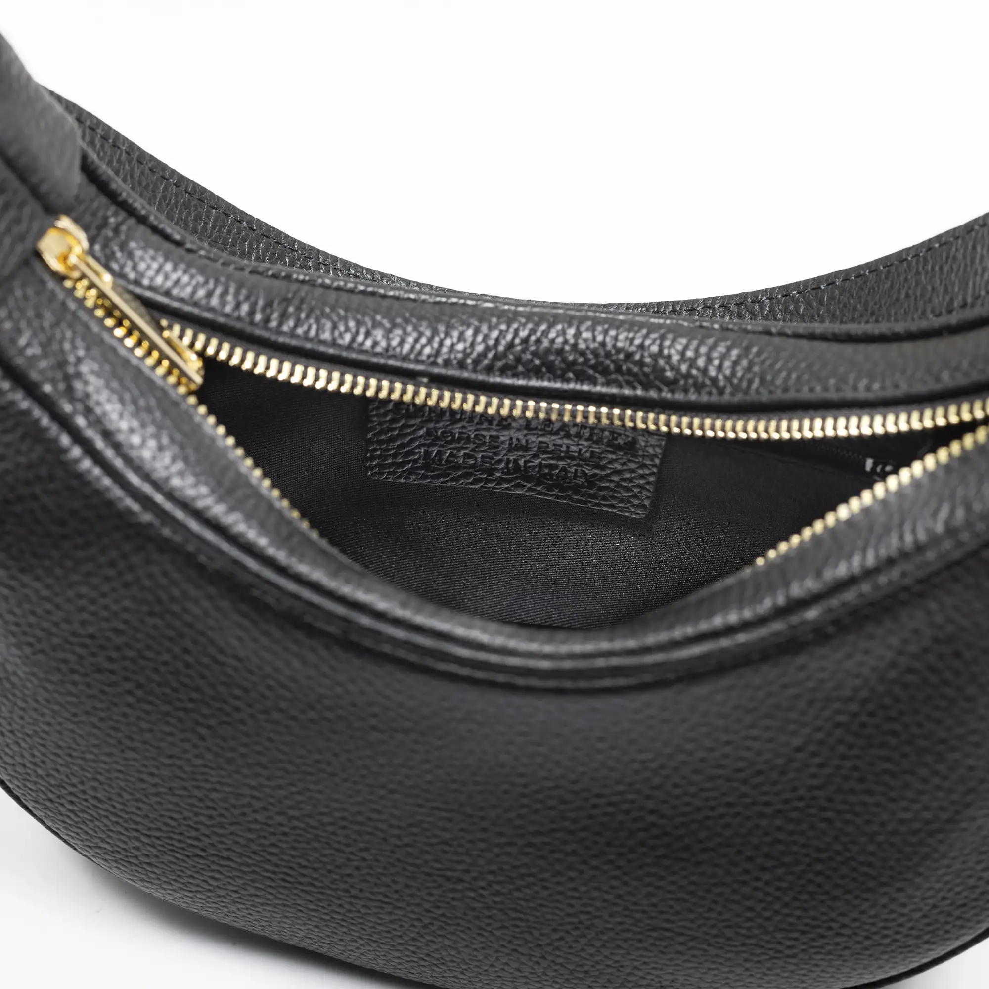 Asís bolso bandolera y mano, de piel auténtica acabado dollaro, con diseño en media luna.